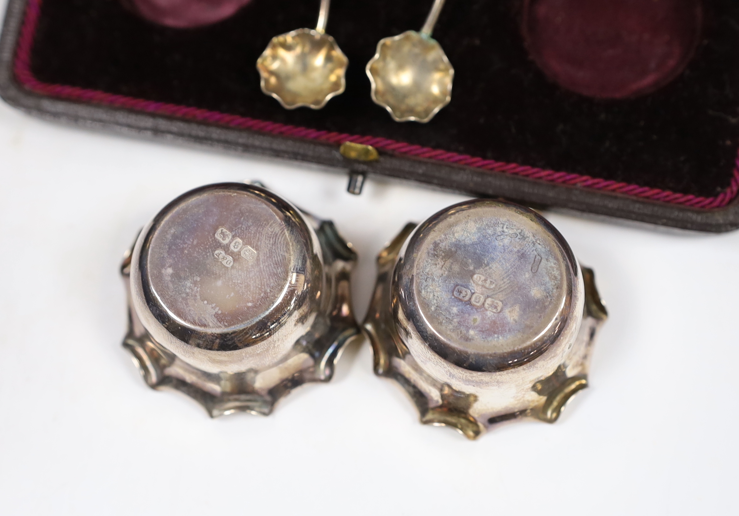 A cased set of four George V silver salts by Mappin & Webb, Birmingham, 1915, no spoons, together with a cased pair of late Victorian silver salts with spoons, Deakin & Francis, Birmingham, 1892.